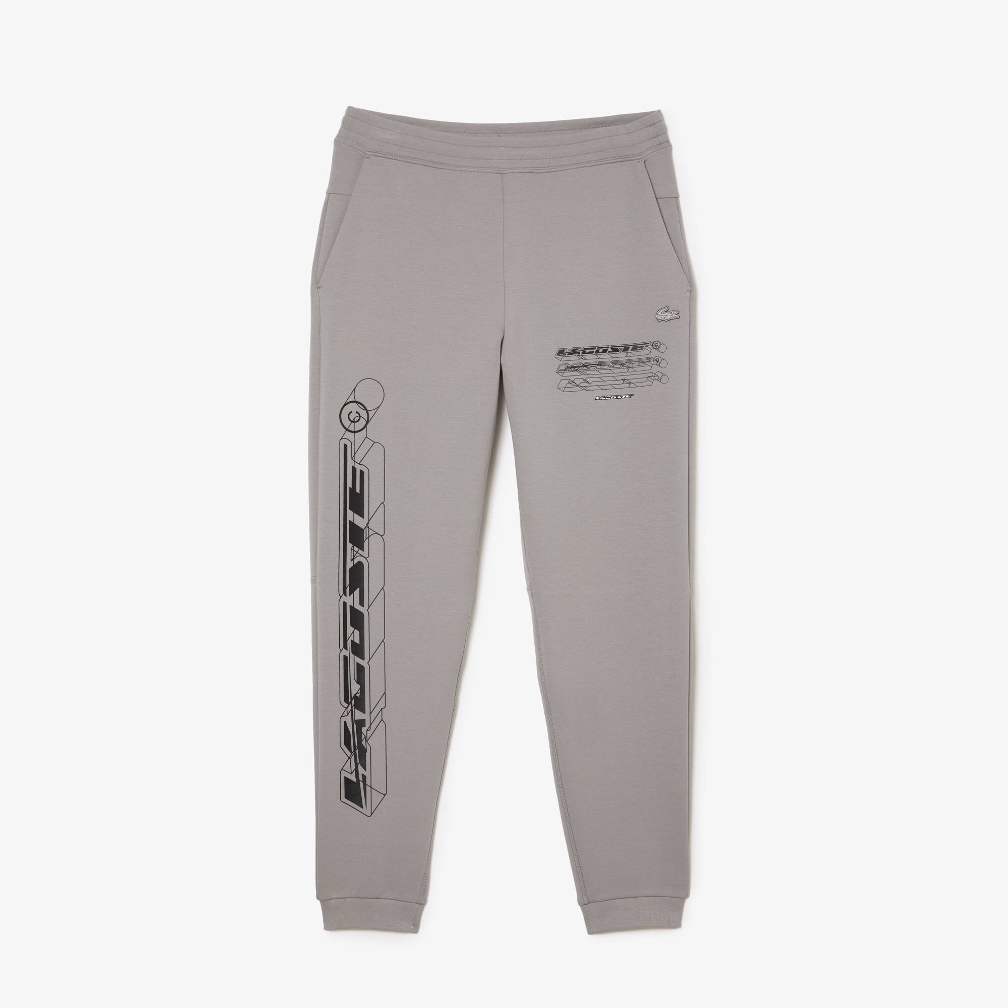 Lacoste Men’s Lacoste Slim Fit Double-Sided Track Pants. 2 Lacoste Men’s Lacoste Slim Fit Double-Sided Track Pants. 2