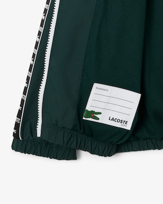 Sportliche Puffer-Jacke mit Kapuze und Logostreifen