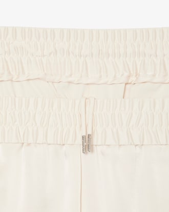 Fließende Hose mit Reißverschlusstaschen