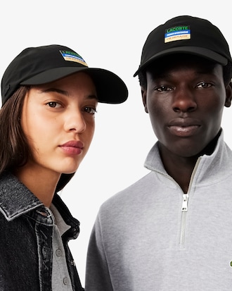Wasserabweisende Cap mit Badge
