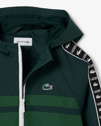 Sportliche Puffer-Jacke mit Kapuze und Logostreifen