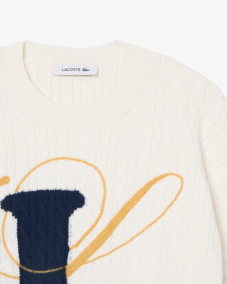 Strickpullover mit Intarsien-Zopfmuster und Stickerei
