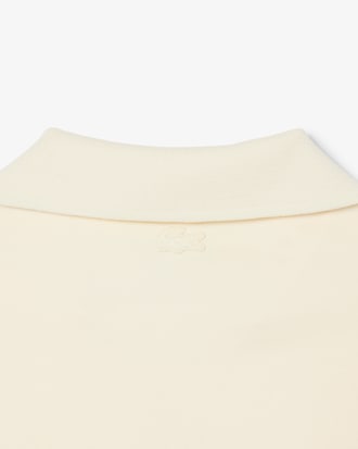 Polo loose fit molleton avec badge