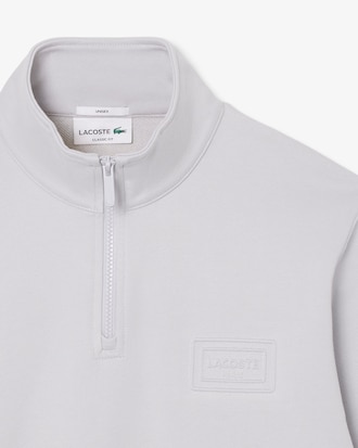 Sweatshirt col montant zipp&eacute; marquage emboss&eacute;