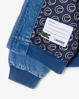 Bomber denim rembourr&eacute; avec badge