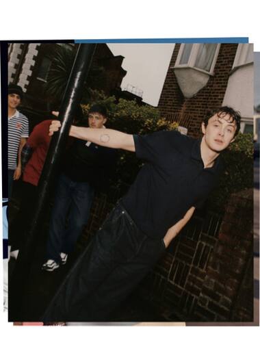 slim navy blue short sleeve polo shirt worn by Sonny Hall