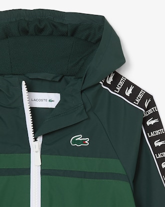 Sportliche Puffer-Jacke mit Kapuze und Logostreifen