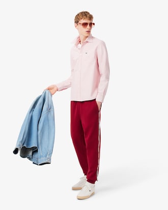 Pantalon de surv&ecirc;tement liser&eacute;s griff&eacute;s