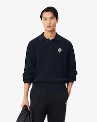 Pull col polo maille perl&eacute;e badge