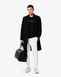 Pantalon de surv&ecirc;tement liser&eacute;s griff&eacute;s