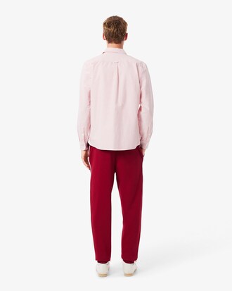 Pantalon de surv&ecirc;tement liser&eacute;s griff&eacute;s