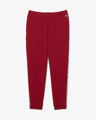 Pantalon de surv&ecirc;tement liser&eacute;s griff&eacute;s