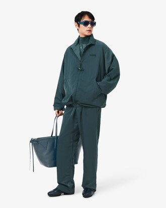 Veste de surv&ecirc;tement brillante D&eacute;fil&eacute;