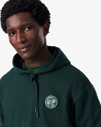 Sweatshirt &agrave; capuche molleton avec badge
