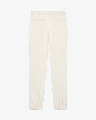 Pantaloni fluidi con tasca e zip