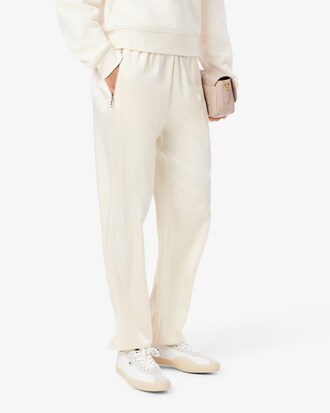 Pantaloni fluidi con tasca e zip