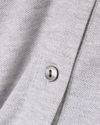 Tuta con collo a polo in piqu&eacute; elasticizzato