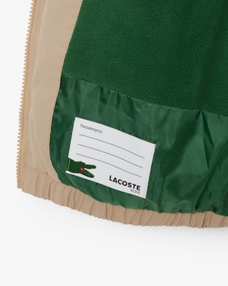 Giacca imbottita con cappuccio e coccodrillo ricamato