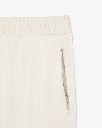Pantaloni fluidi con tasca e zip