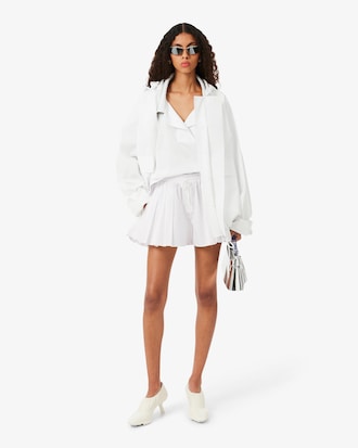Shorts in popeline plissettati con stampa Runway