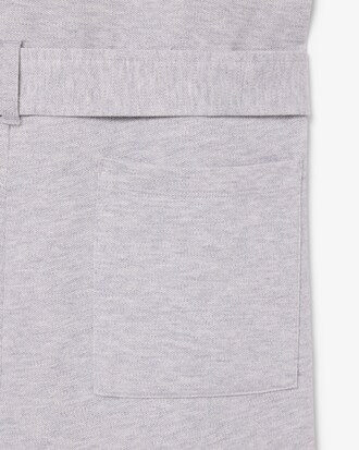 Tuta con collo a polo in piqu&eacute; elasticizzato