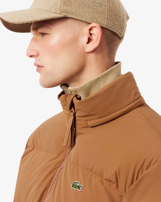 Piumino con cappuccio impermeabile