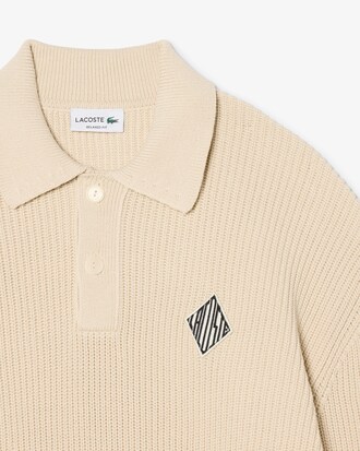 Maglione con collo a polo a coste perlate e stemma