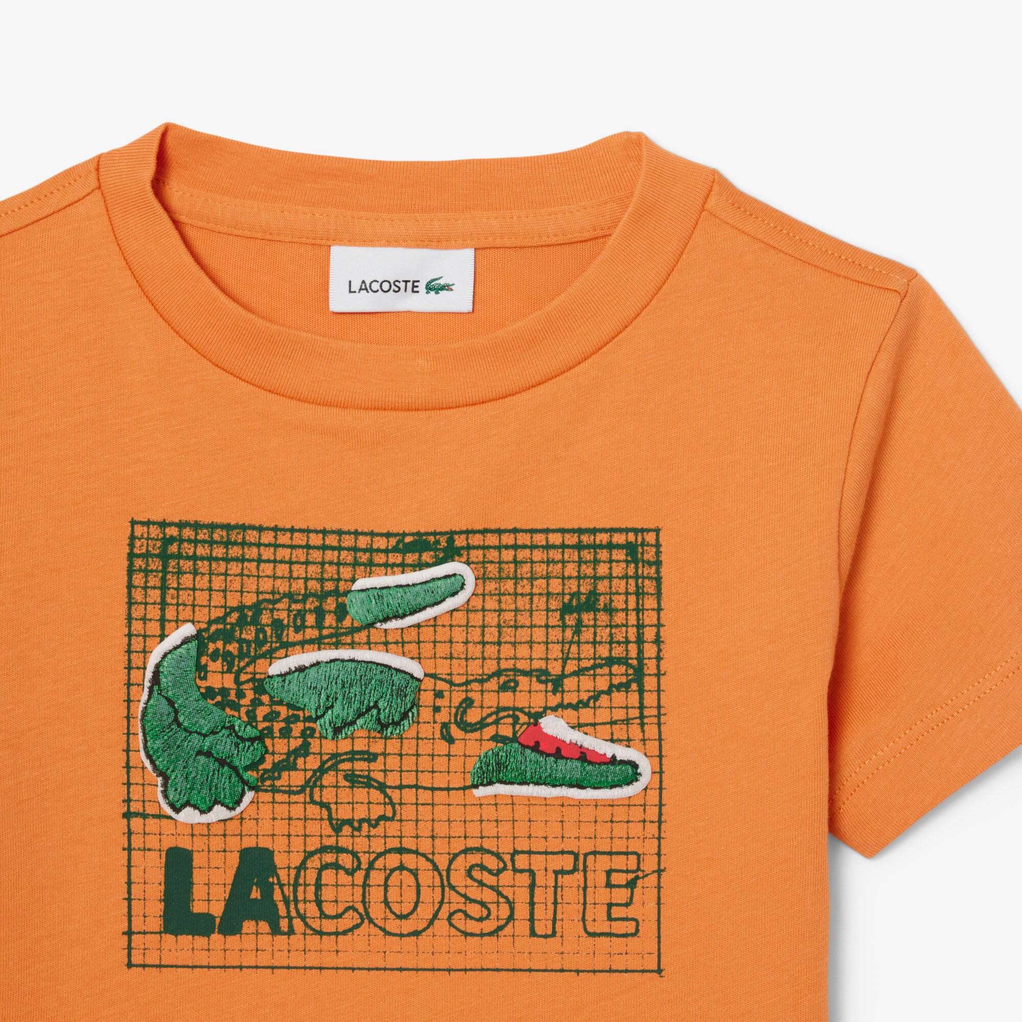 Thumbnail - Lacoste T-Shirt aus Baumwolle mit grafischem Print - Orange Size 5 - 5A