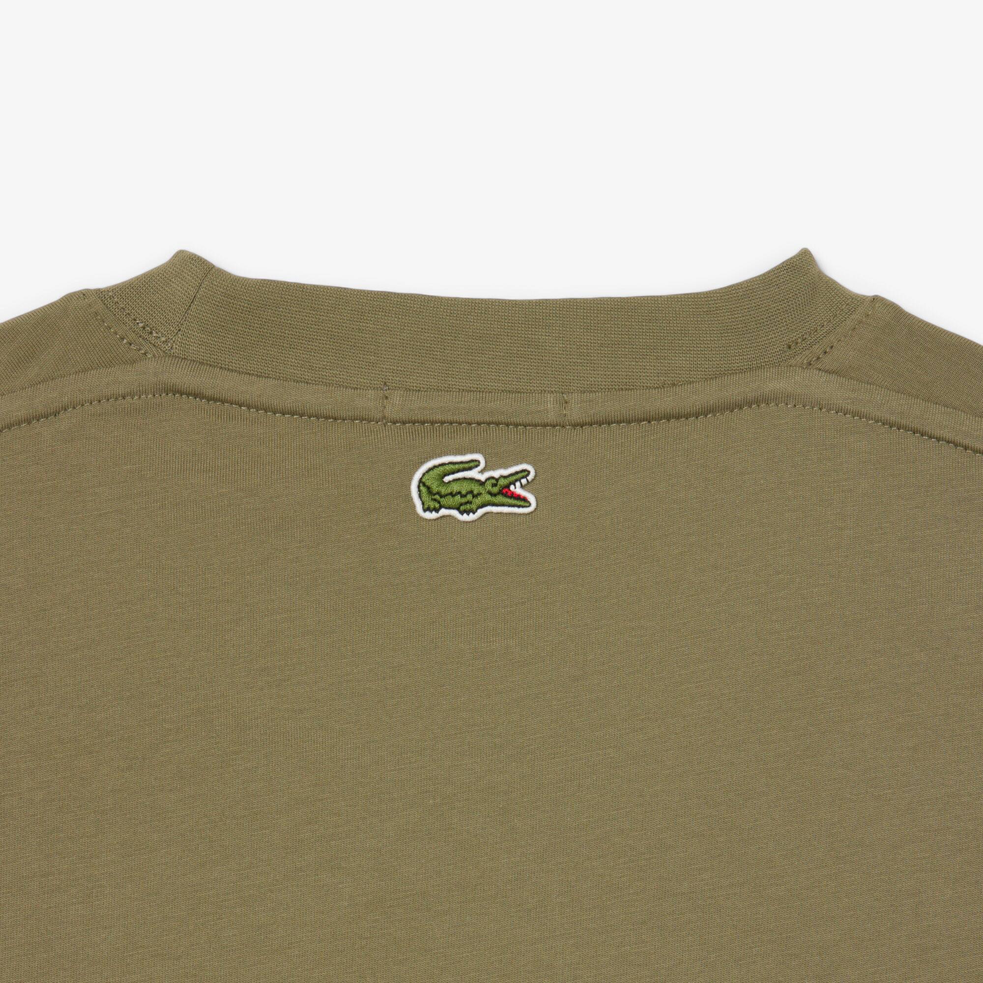Thumbnail - Lacoste T-Shirt aus Baumwolle mit Signatur-Print - Khaki Grün Size S