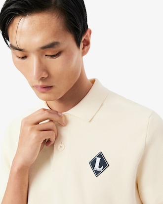 Franz&ouml;sischer Pullover mit Badge-Akzent und Polokragen