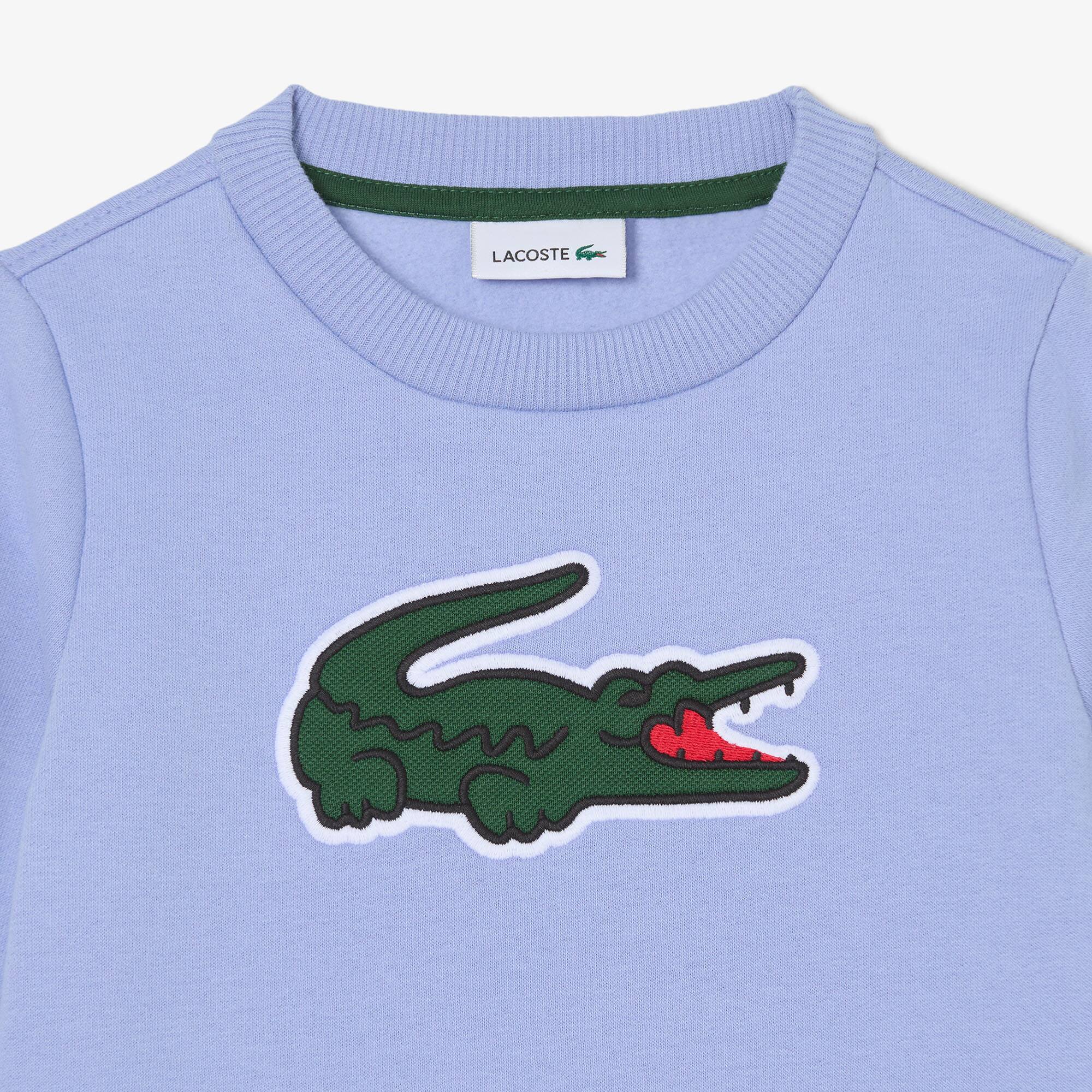 Thumbnail - Lacoste Sweatshirt aus Fleece mit Print - Lila Size 5 - 5A