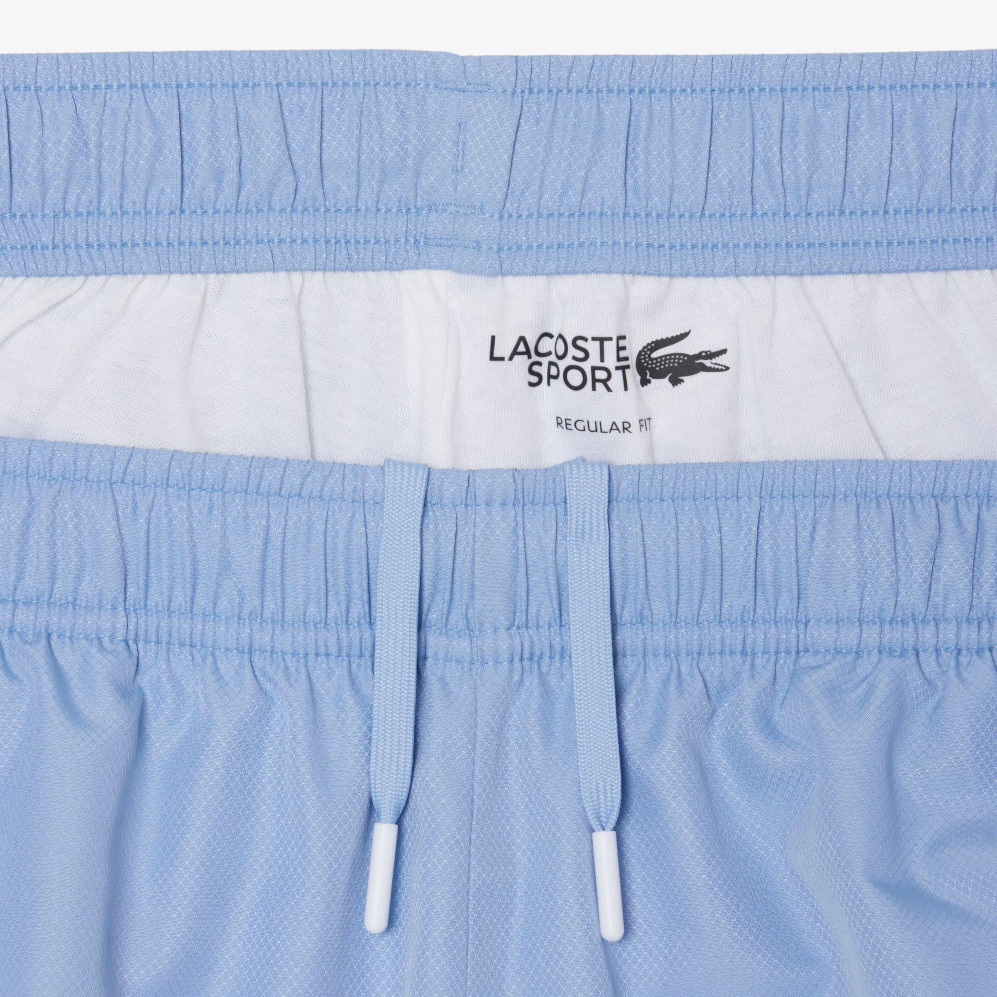 Thumbnail - Lacoste Sportshorts aus Diamant-Taft mit Streifenakzent - Bleu Clair / Rouge Size 3XL