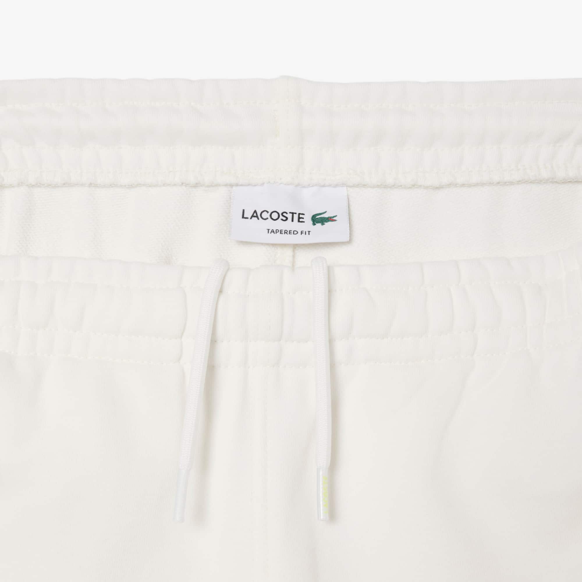 Thumbnail - Lacoste Trainingshose aus Fleece mit zulaufenden Beinen - Weiß / Khaki Grün / Lila Size L
