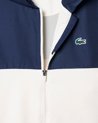 Wasserabweisende Tennisjacke mit Kapuze