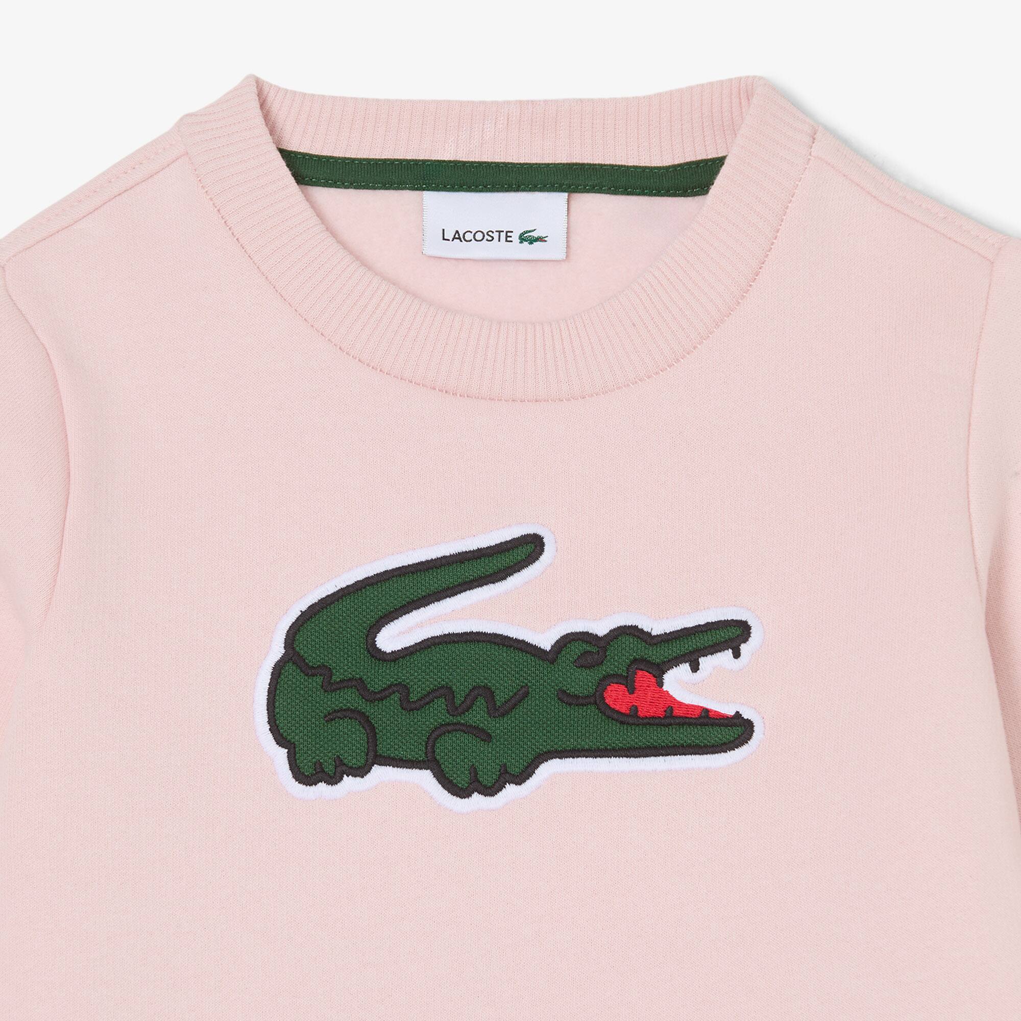 Thumbnail - Lacoste Unisex-Sweatshirt aus Fleece mit Print - Hellrosa Size 6 - 6A