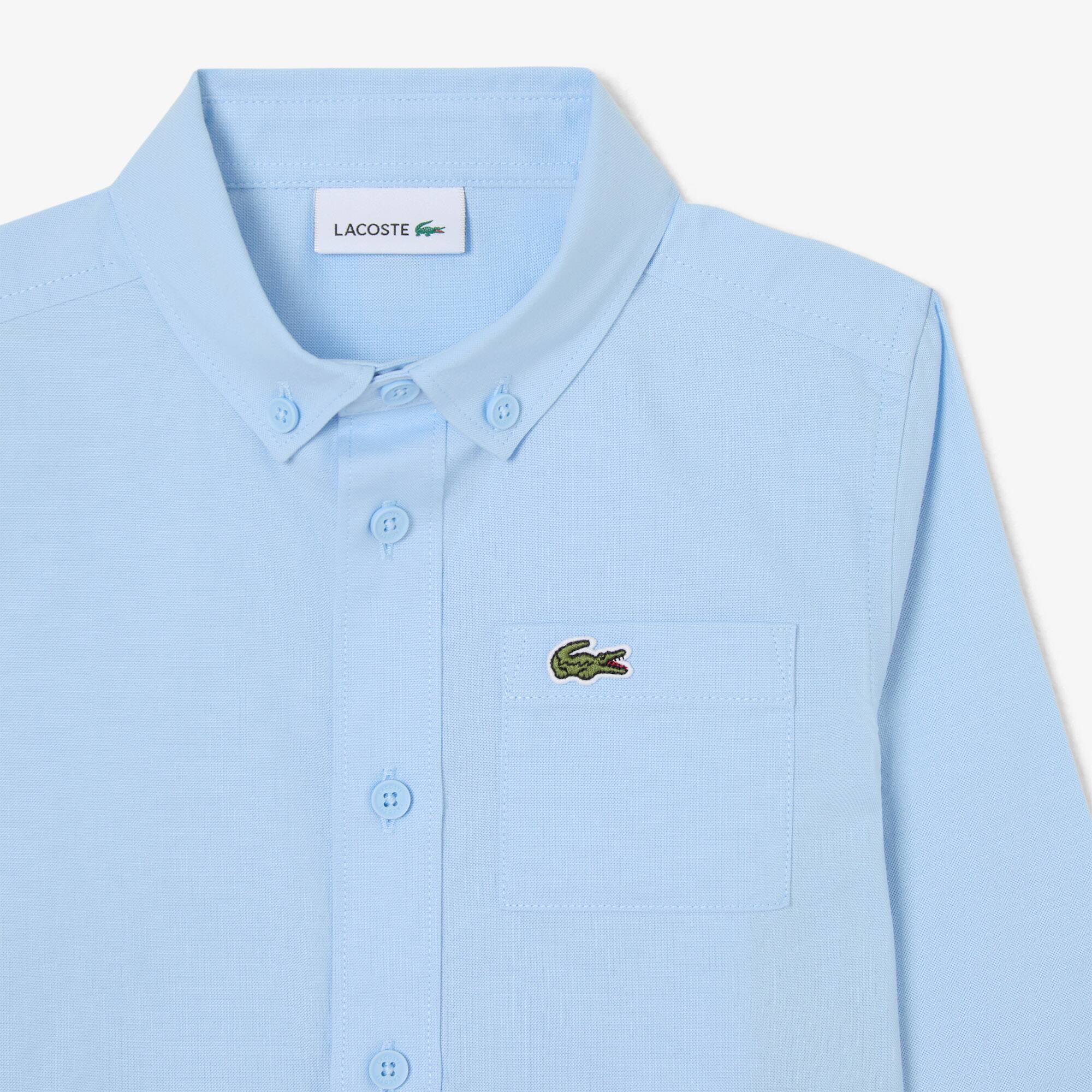 Thumbnail - Lacoste Hemd aus Baumwoll-Oxford mit Brusttasche - Pastellblau Size 4 - 4A