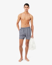 Short de ba&ntilde;o de largo medio con estampado de monograma