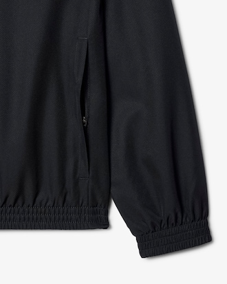 Chaqueta de tenis con capucha hidrófuga