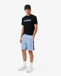 Pantal&oacute;n corto de tenis ligero de rayas con bloques de color