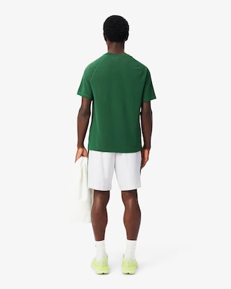 Pantal&oacute;n corto deportivo de tafet&aacute;n diamantado con franja en contraste