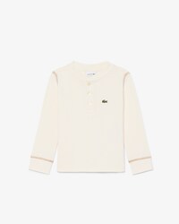 Camiseta con botones de punto gofrado