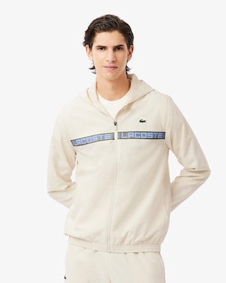 Ch&aacute;ndal de tenis con raya con logotipo