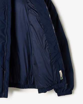 Chaqueta acolchada con capucha y cocodrilo bordado