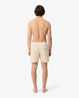 Short de ba&ntilde;o texturizado de rayas de largo medio