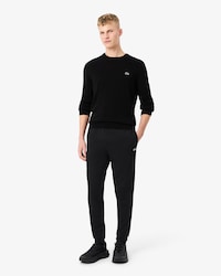 Pantal&oacute;n de ch&aacute;ndal con raya y logotipo