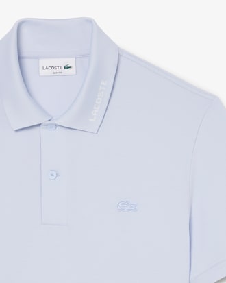 Polo Commuter de piqu&eacute; de corte ajustado con detalles de marca de jacquard