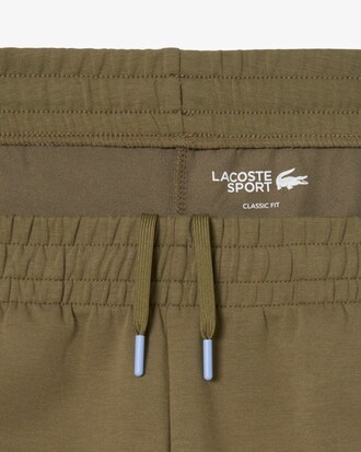 Pantal&oacute;n de ch&aacute;ndal de tenis con raya de logotipo