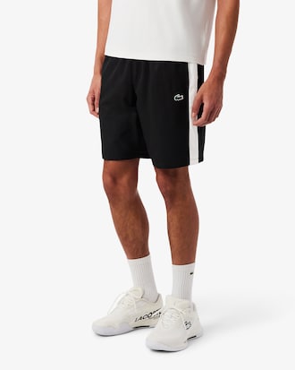 Pantal&oacute;n corto deportivo de tafet&aacute;n diamantado con franja en contraste