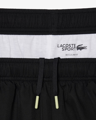 Pantal&oacute;n corto deportivo de tafet&aacute;n diamantado con franja en contraste