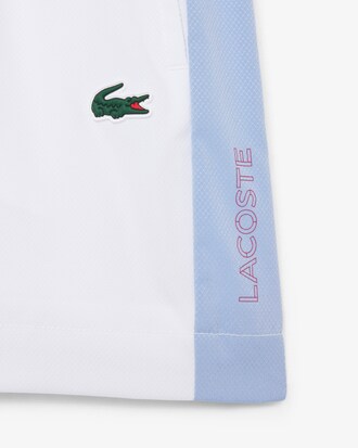 Pantal&oacute;n corto deportivo de tafet&aacute;n diamantado con bloques de color